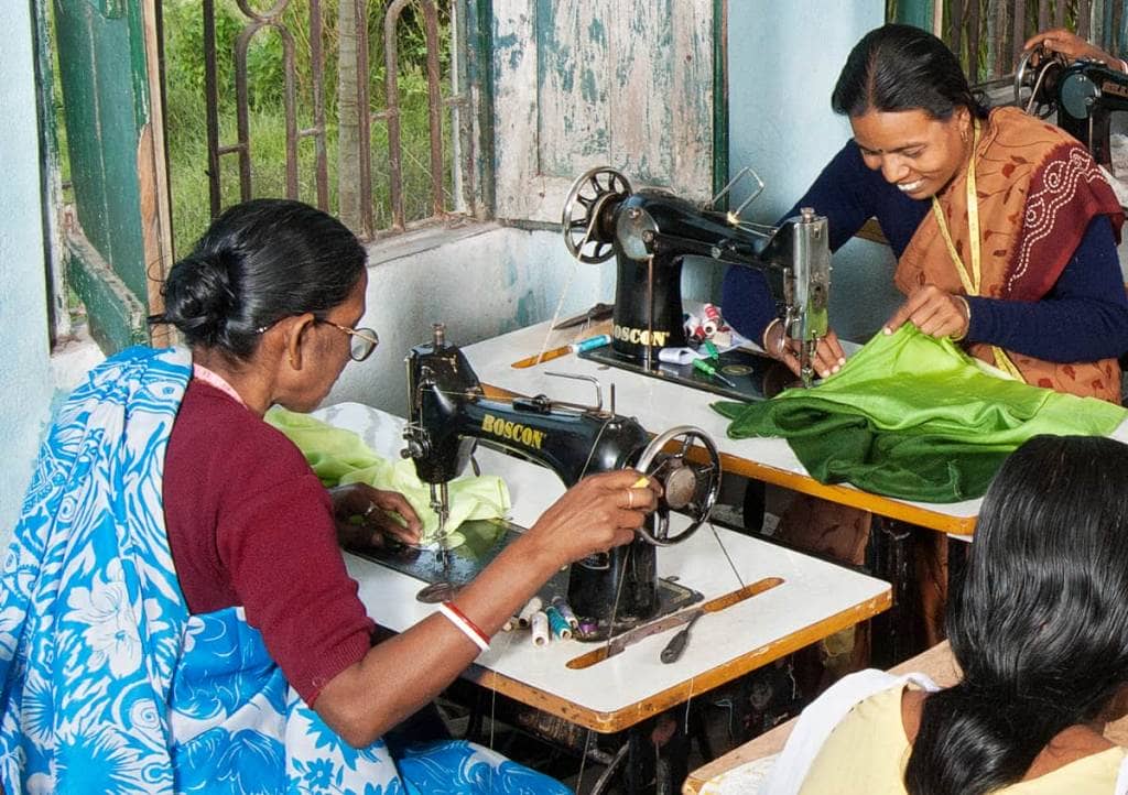 Women sewing at Kolaghat SEWS making garments for Sasha