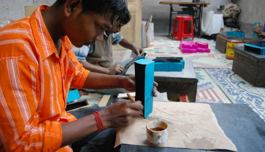 Assembling a leather product at Shanti Handicrafts