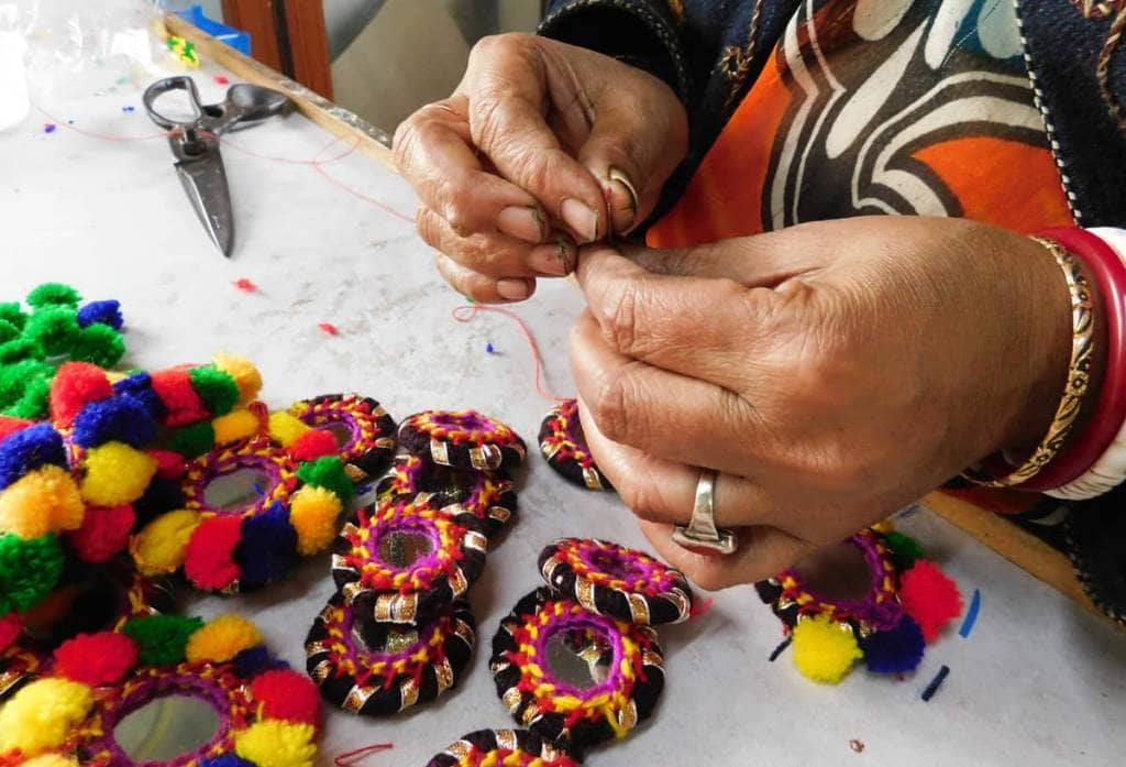 Prachesta-closeup-making-widget Closeup woman's hands working at Prachesta